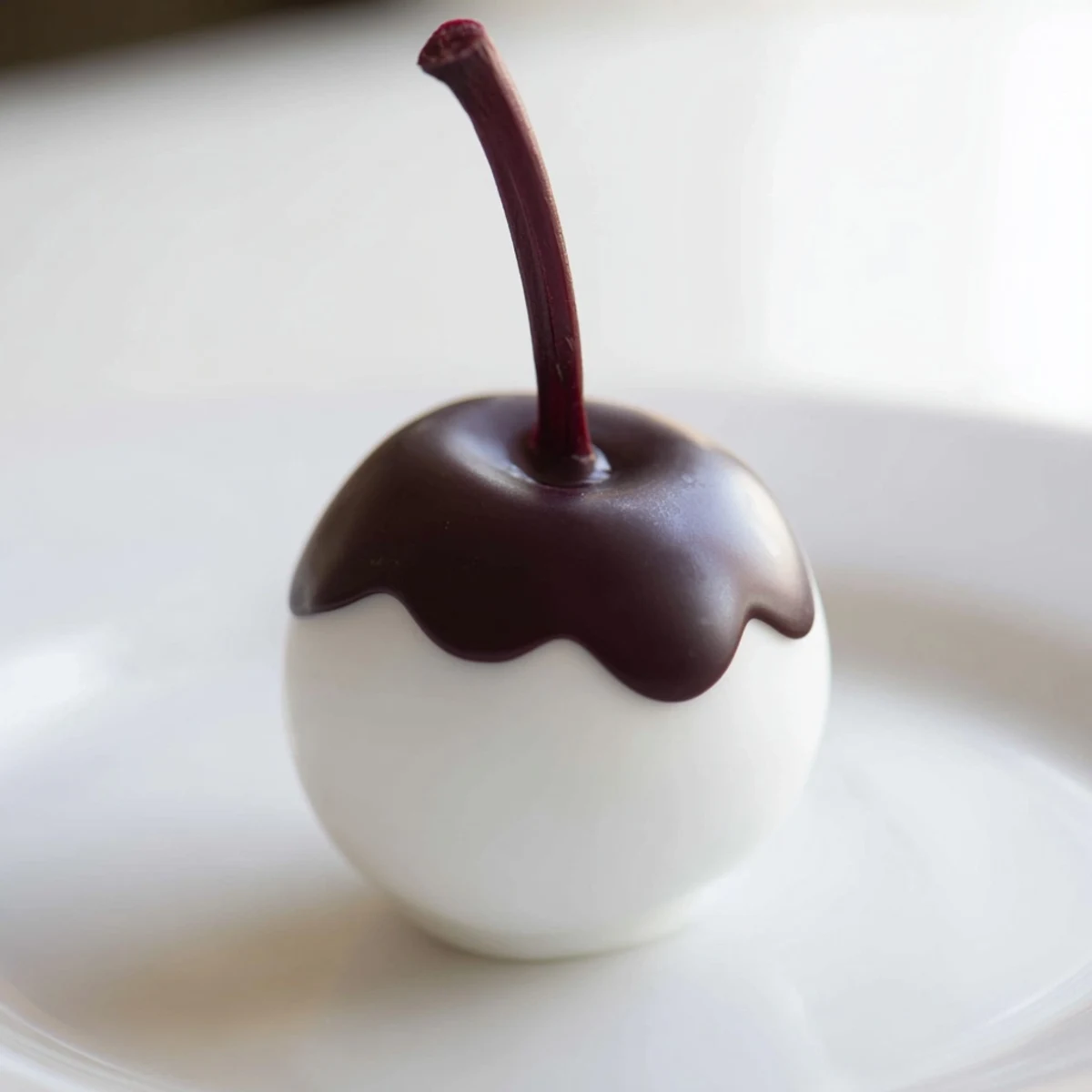 Plump maraschino cherries wrapped in smooth fondant and dipped in rich dark chocolate.