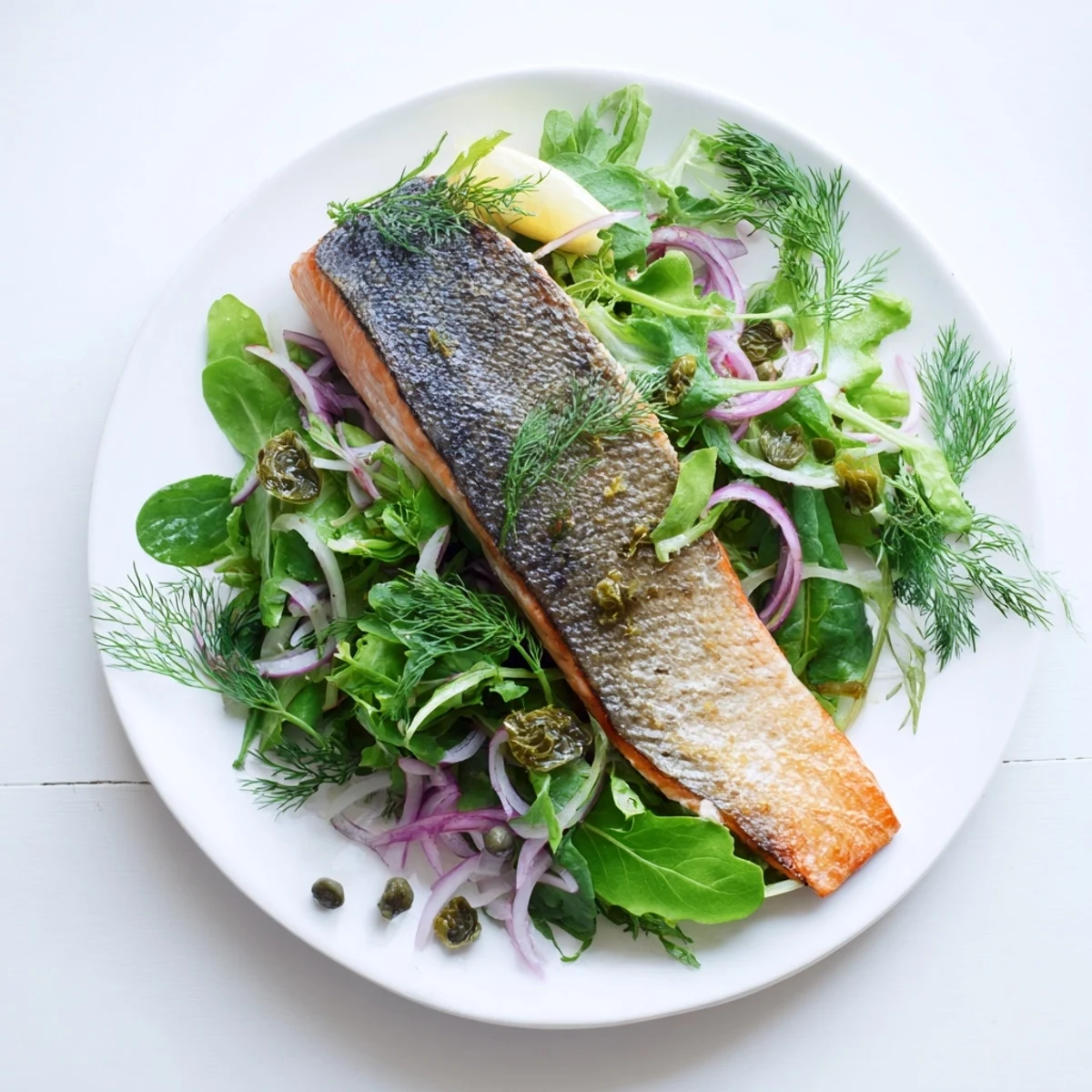 Perfectly cooked Tasmanian Atlantic salmon with crackling skin, topped with arugula and a zesty lemon herb vinaigrette.