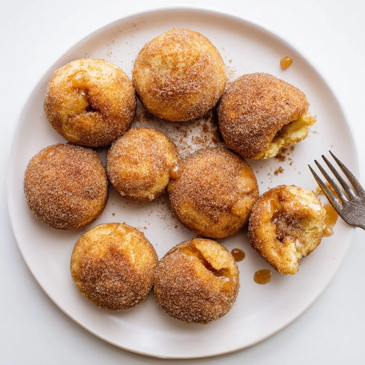 Baked caramel apple pie bombs featuring tender spiced apples wrapped in flaky biscuit dough