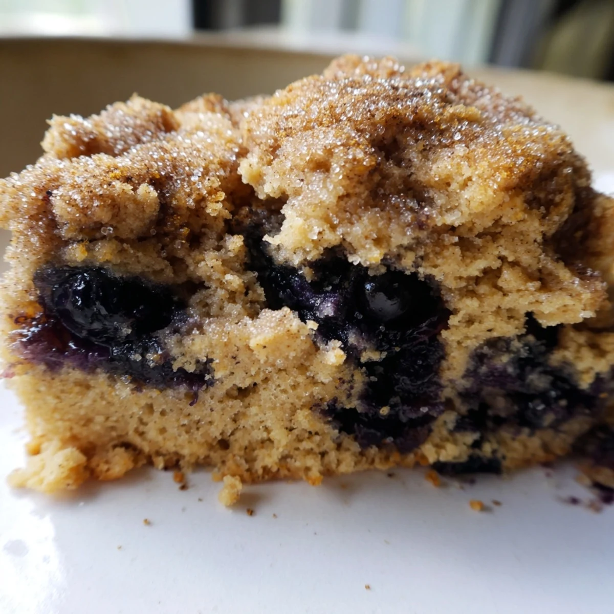 Tender wedge-shaped Vietnamese cinnamon blueberry scones on a rustic wooden board ready for breakfast