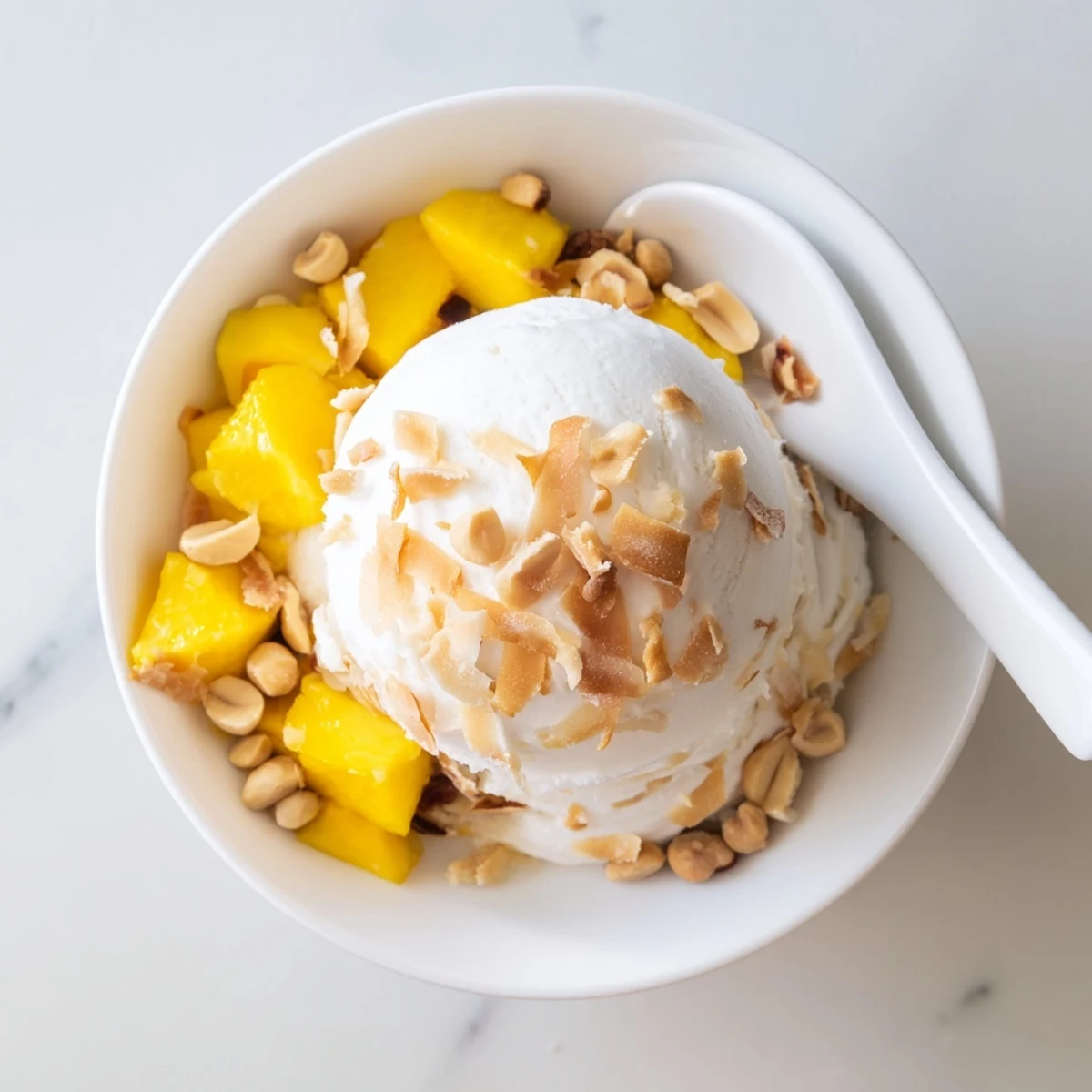 Dairy-free Thai coconut milk ice cream served in a chilled glass with vanilla notes