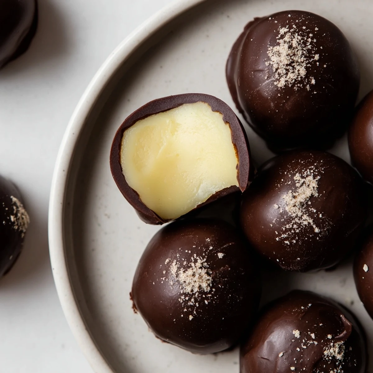 Box of Dark Chocolate Eggnog Truffles nestled for gifting, rich and smooth