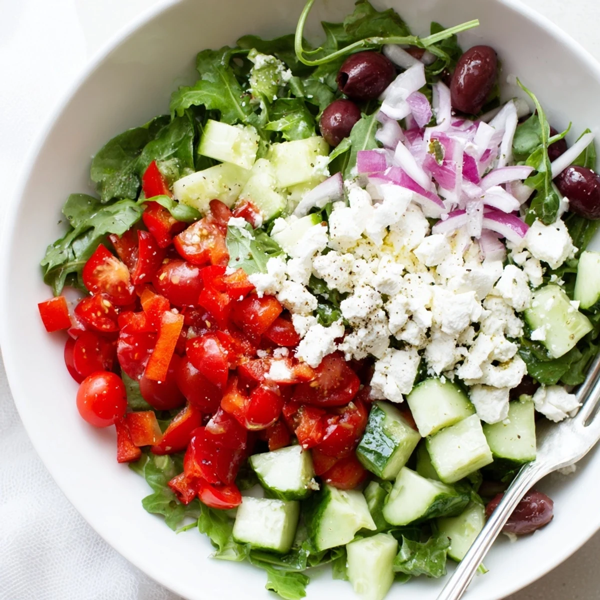 Bright bowl of mixed greens in this Fresh Salad Recipe, tossed and chilled.