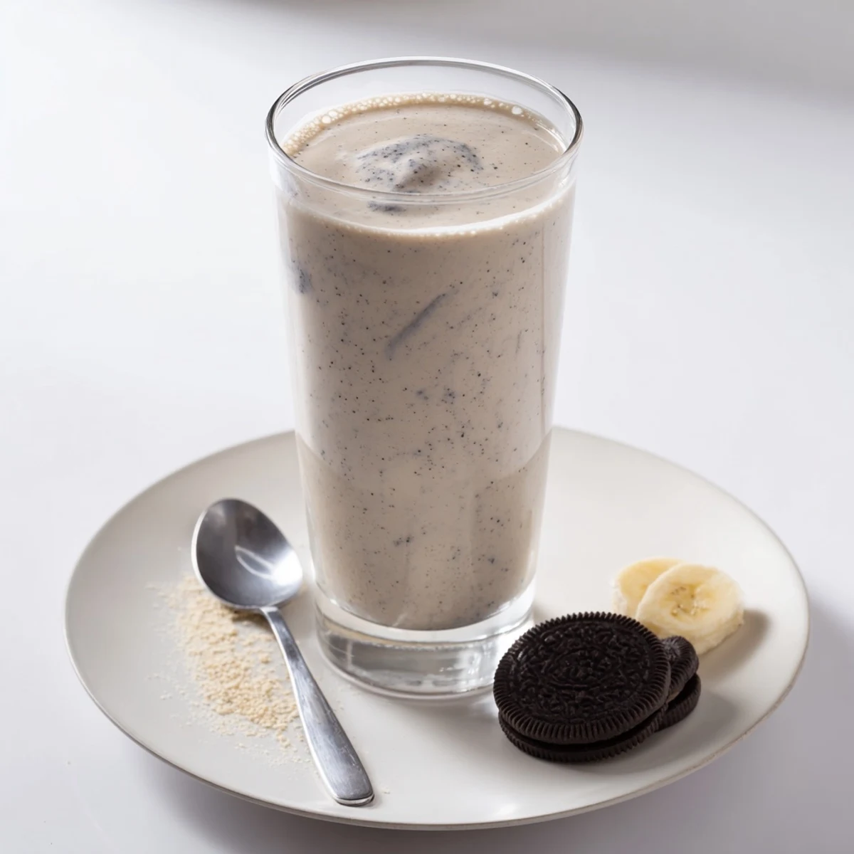 Thick Cookies And Cream Protein Shake garnished with crushed cookies, perfect post-workout
